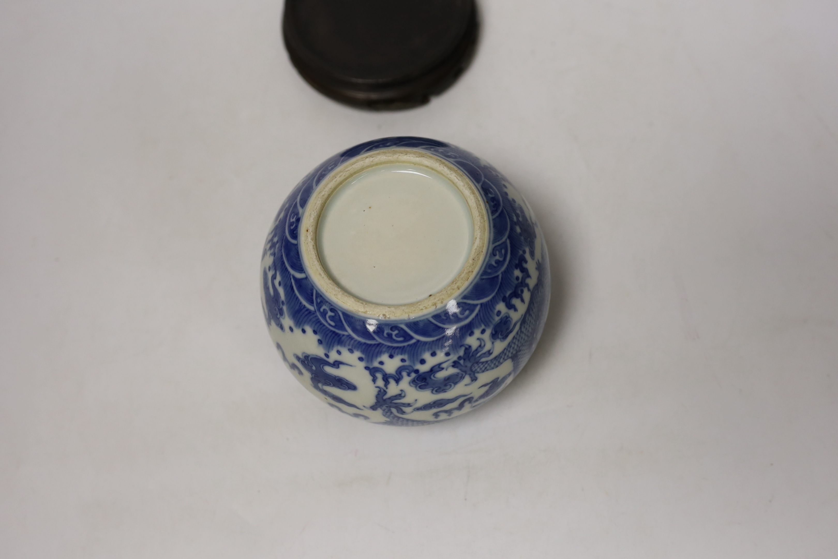 A Chinese blue and white dragon water pot on stand, bowl 12.5cm high including stand